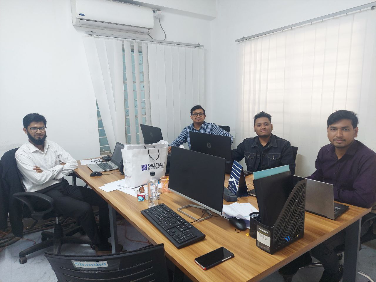 With colleagues at Sheltech Consultants
